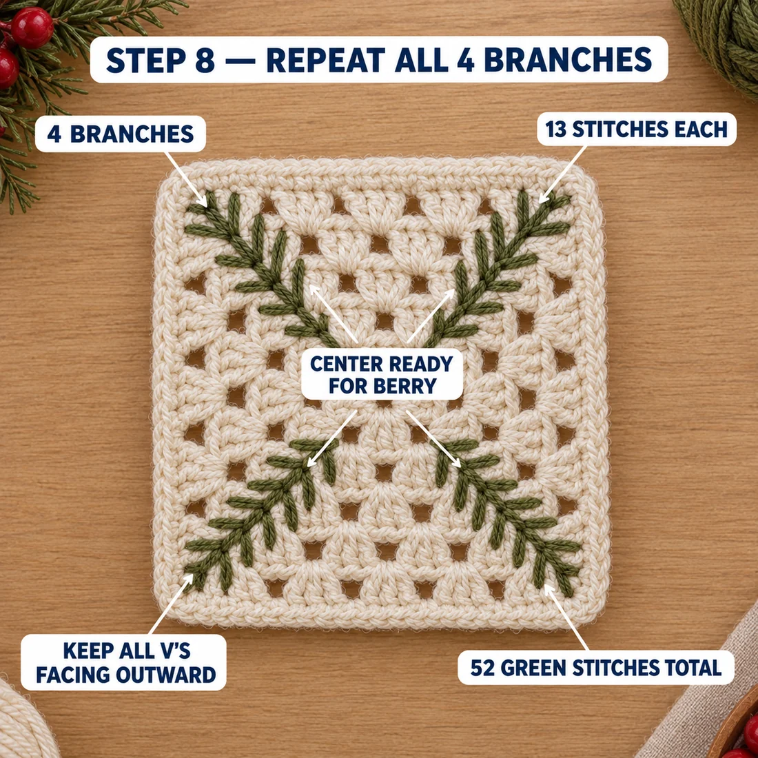 Step 8 of the Christmas granny square: all four olive pine branches stitched from the center to each corner, with the center left clear for the berry