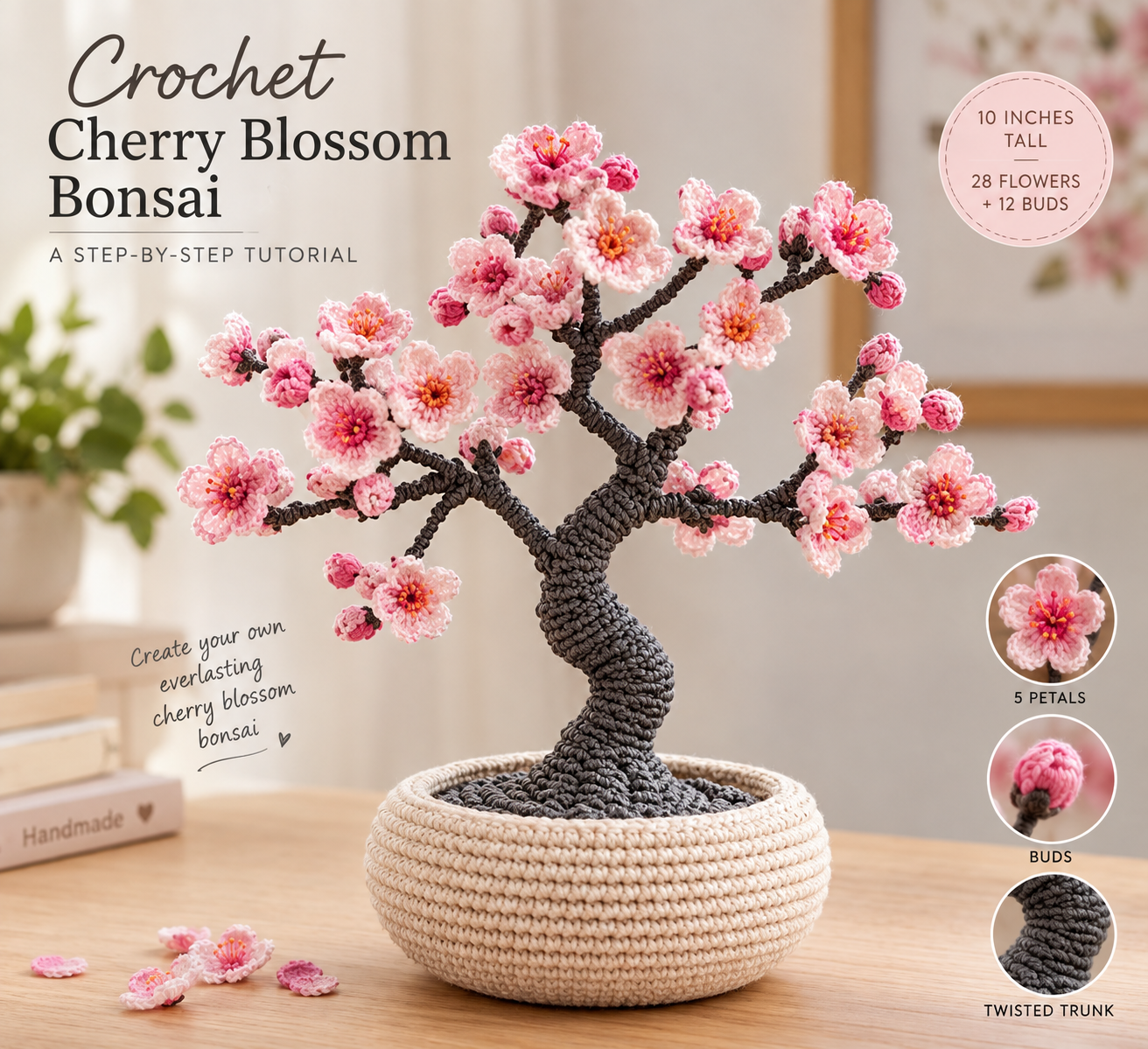 Crochet cherry blossom bonsai with a twisted charcoal trunk, clusters of two-tone pink blossoms and buds, planted in a round cream crocheted pot on a light wood table