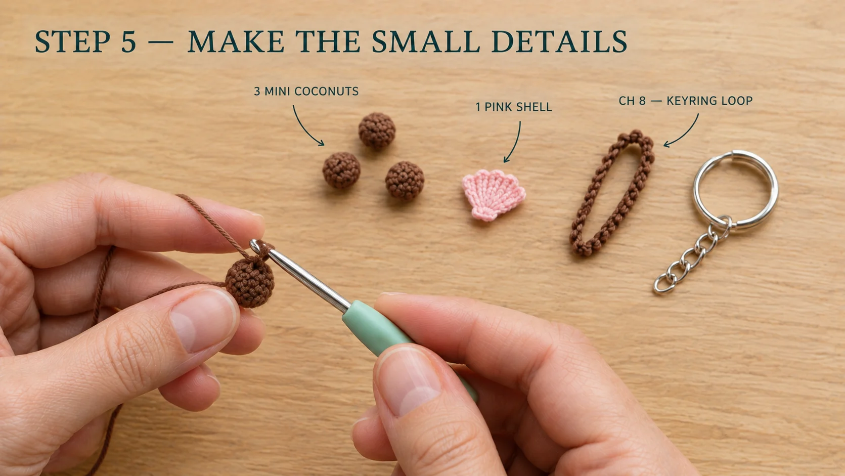 Step 5 of the crochet palm tree keychain: three mini brown coconuts, a small pink crochet shell, a brown chain-8 keyring loop and a silver keyring with chain laid out on a wooden table, with one coconut still on the hook